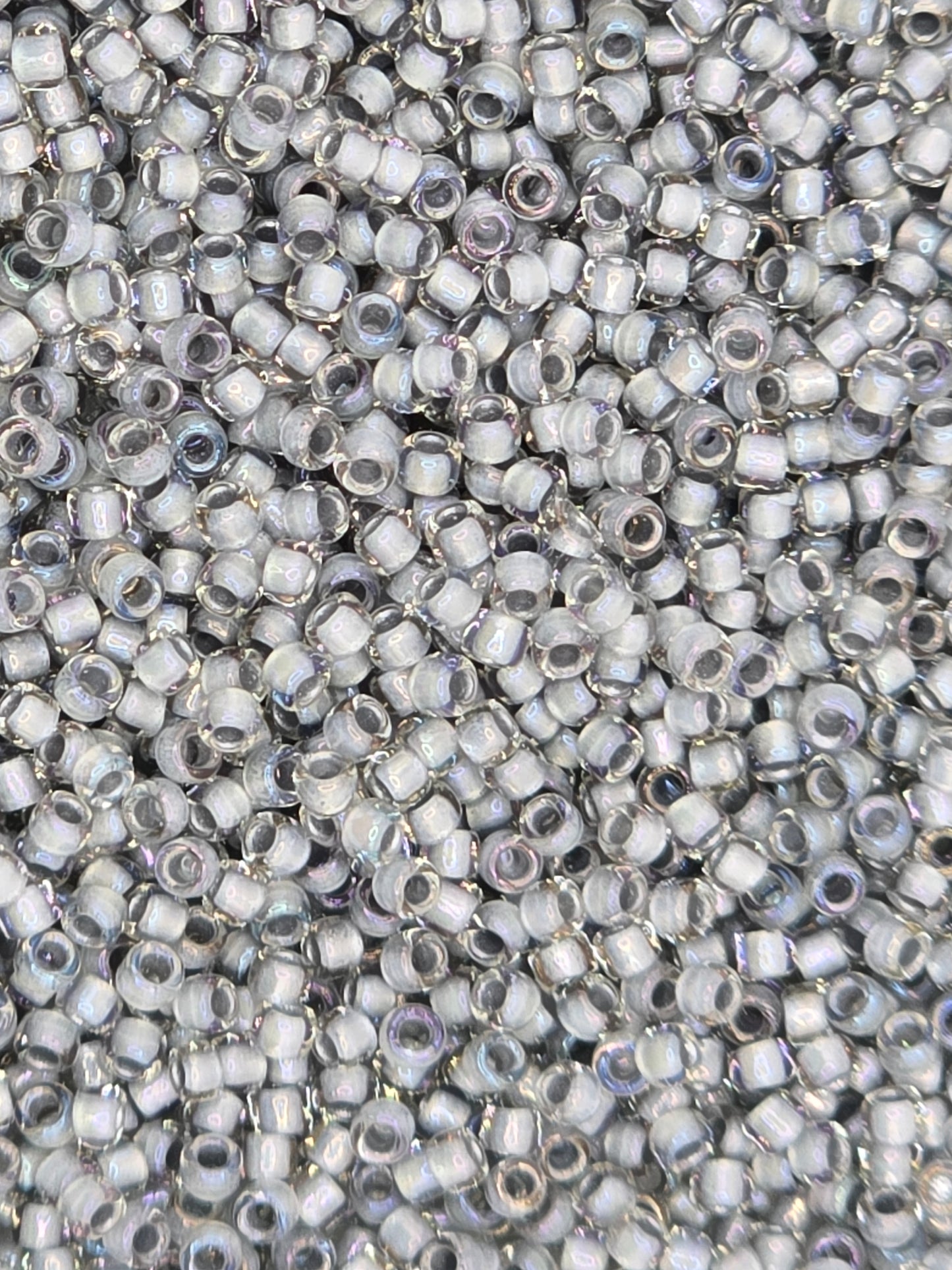 TOHO #15 Seeds - 261 - Inside Rainbow Crystal/Grey Lined - 5 gms